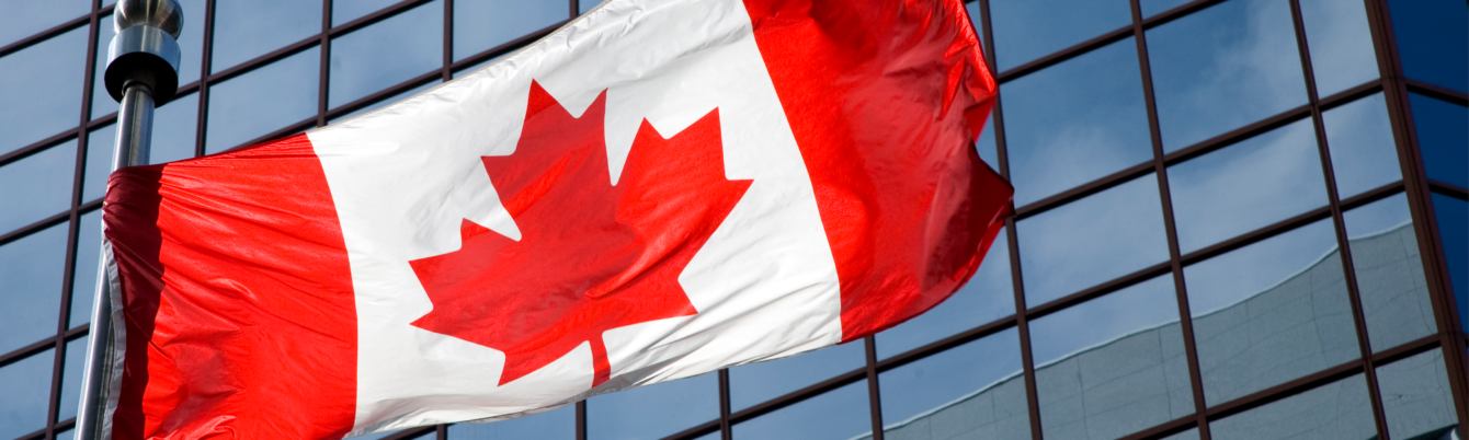 Canadian flag close-up over office building